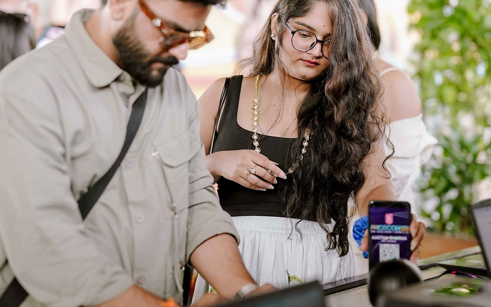 Two guests checking in at VoiceCon